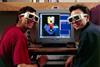 An image showing researchers with 3D glasses in front of molecular model